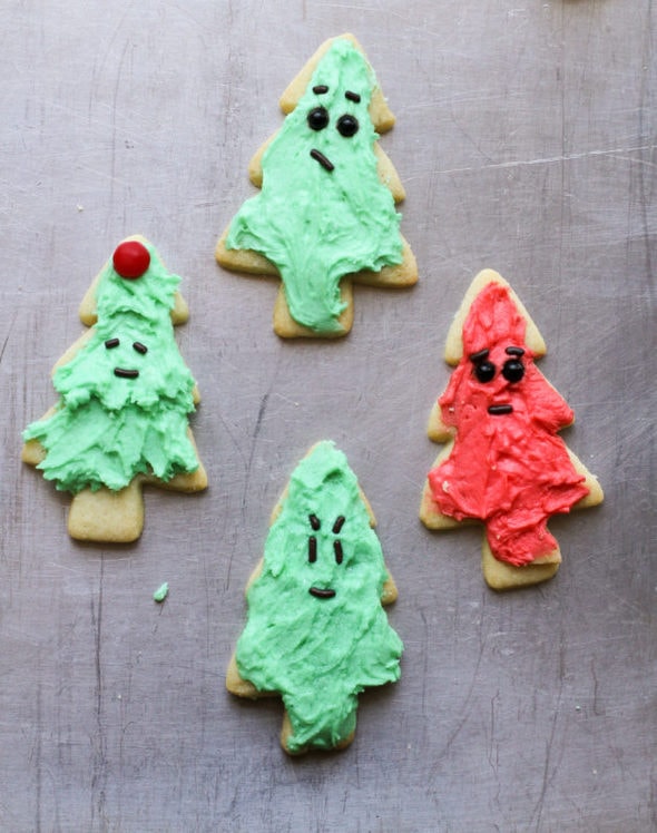 Four small Christmas tree cookies.