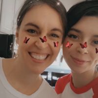 Kristen and Lisey with a butterfly filter on their noses.