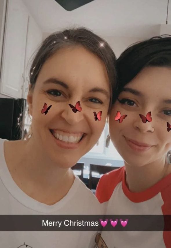 Kristen and Lisey with a butterfly filter on their noses.