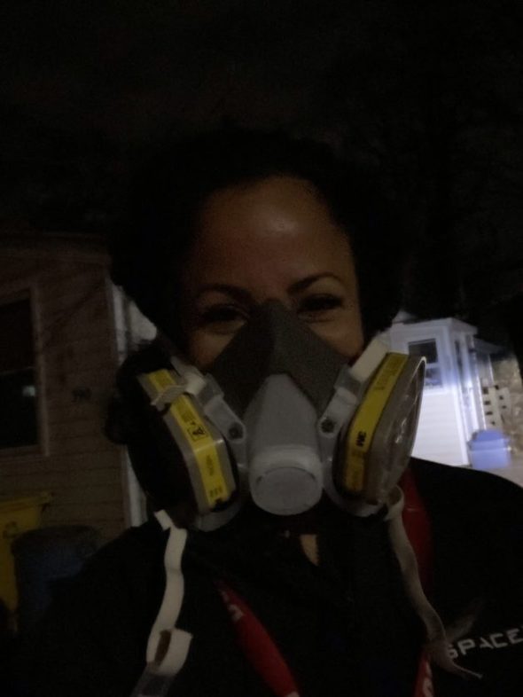a woman wearing a construction mask.
