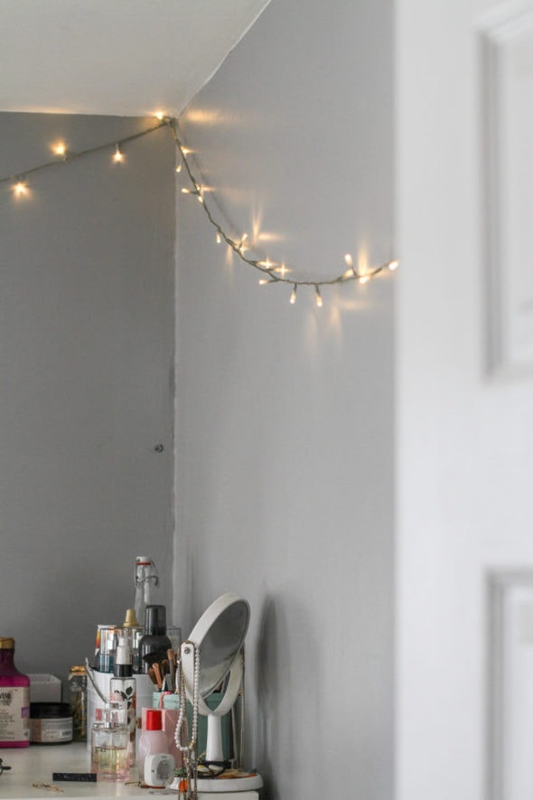 tiny lights on a gray wall.