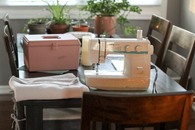 sewing machine on dining room table.