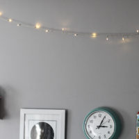 white lights ona gray bedroom wall.