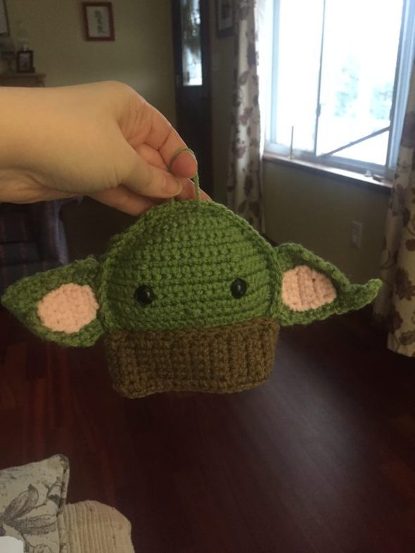 A crocheted baby yoda.