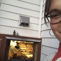 Kristen loading firewood.