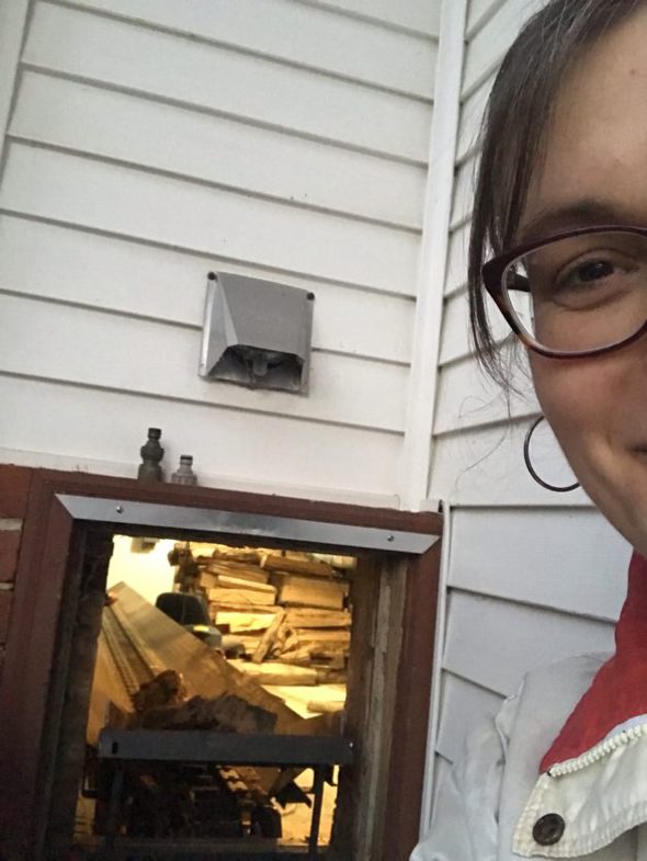 Kristen loading firewood.