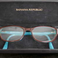 turquoise and brown glasses in a case.