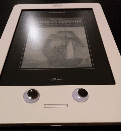 an e-reader with googley eyes.