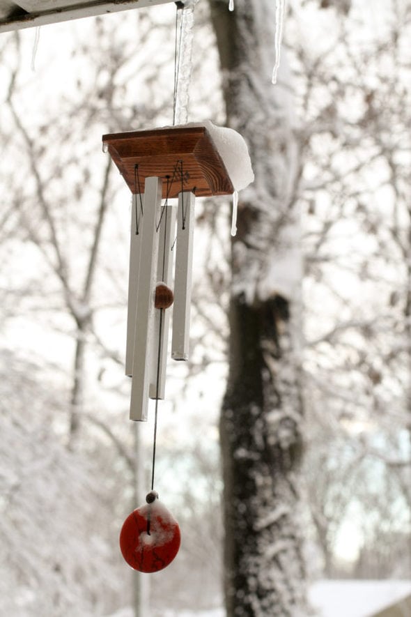 Wind chimes on a snowy day.