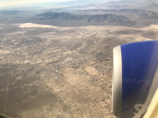view of a desert from a plane window.