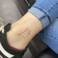 a cat ankle tattoo.