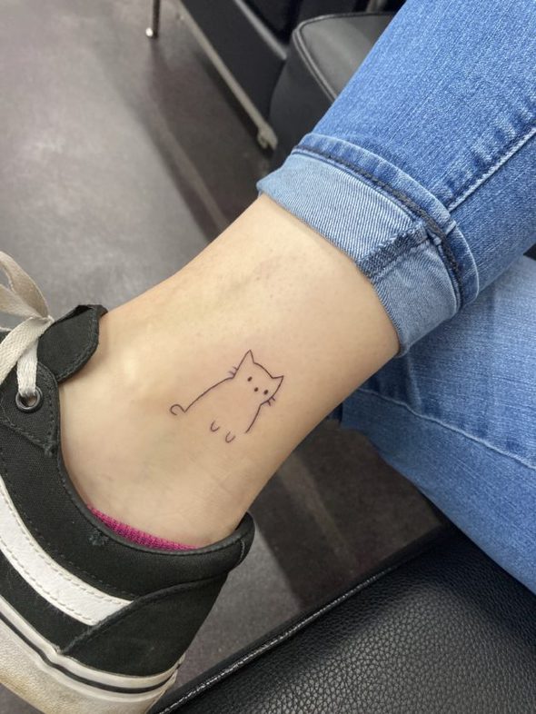 a cat ankle tattoo.