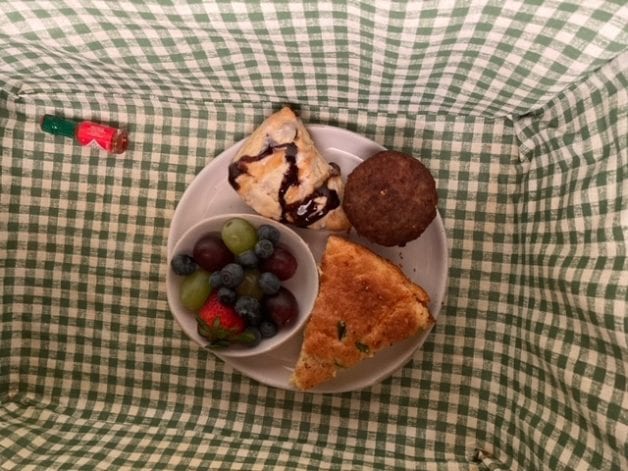 A breakfast plate in a gingham-lined basket.