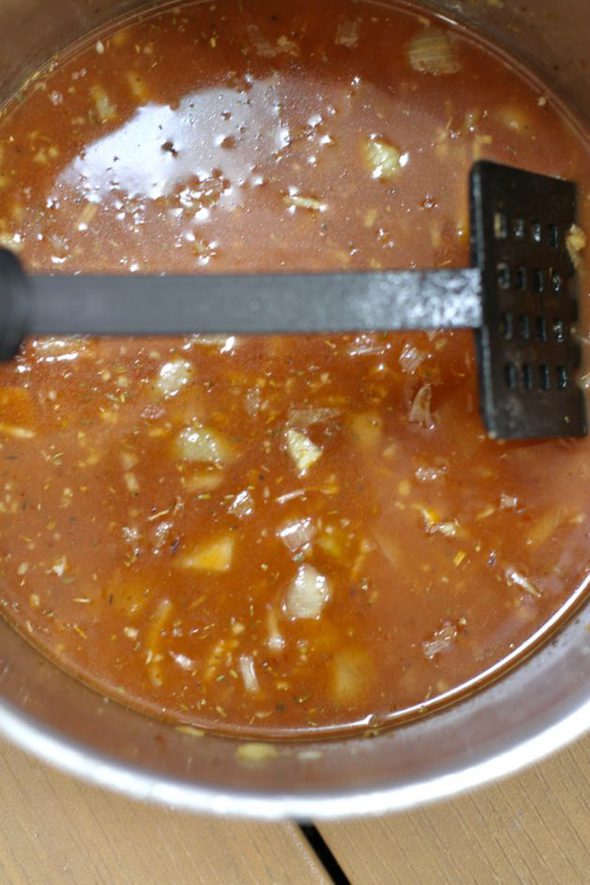 A pot of tomato broth.