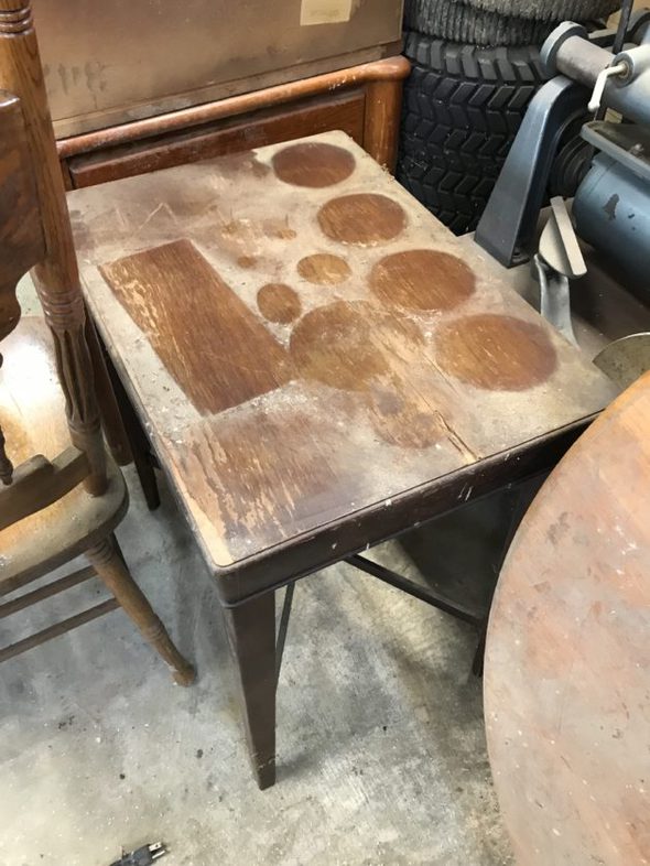 A dusty wooden table.