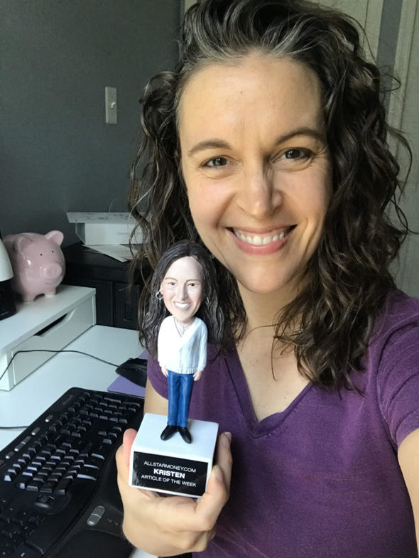 Kristen with a bobblehead of herself