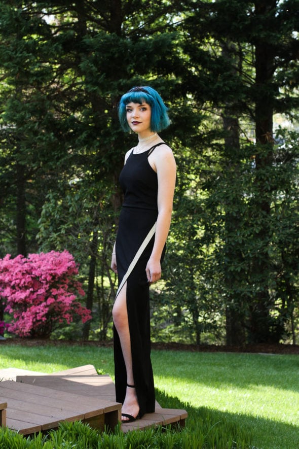 Zoe wearing a black prom dress.