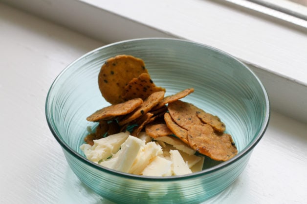 Cheese and crackers in a bowl.