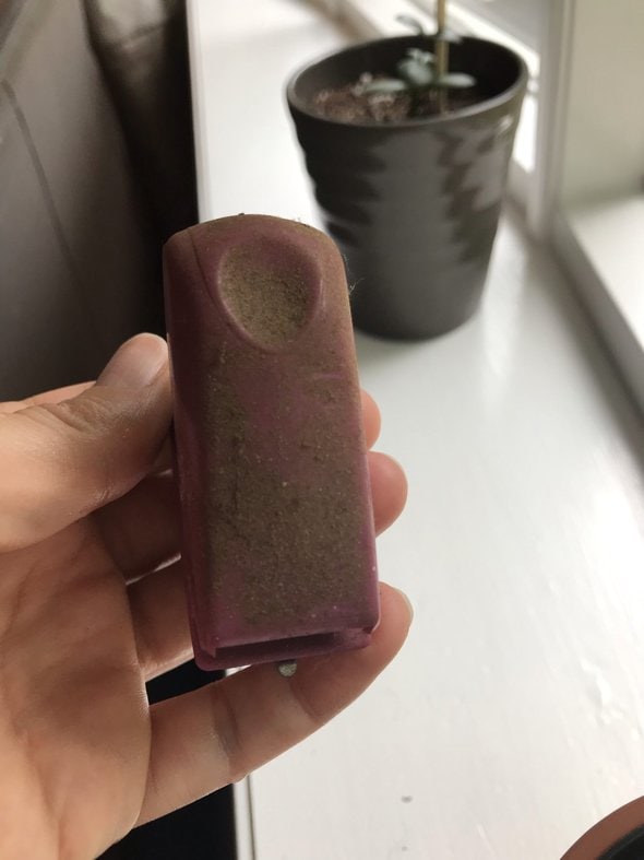 A dirty purple stapler.