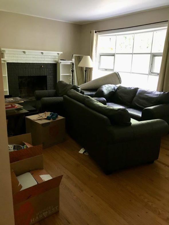 living room full of messy furniture.