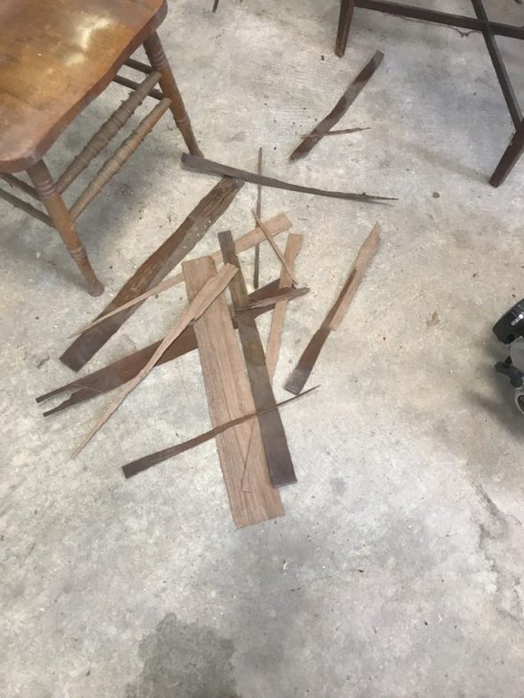 Veneer shards on a garage floor.