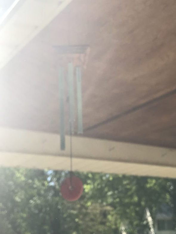 A blurry picture of wind chimes.
