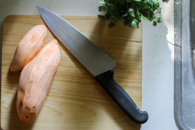 Sweet potatoes on a cutting board.