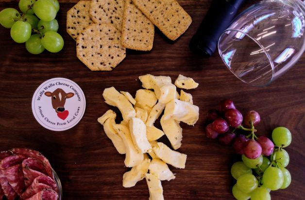 flat lay photo of cheese and fruit.