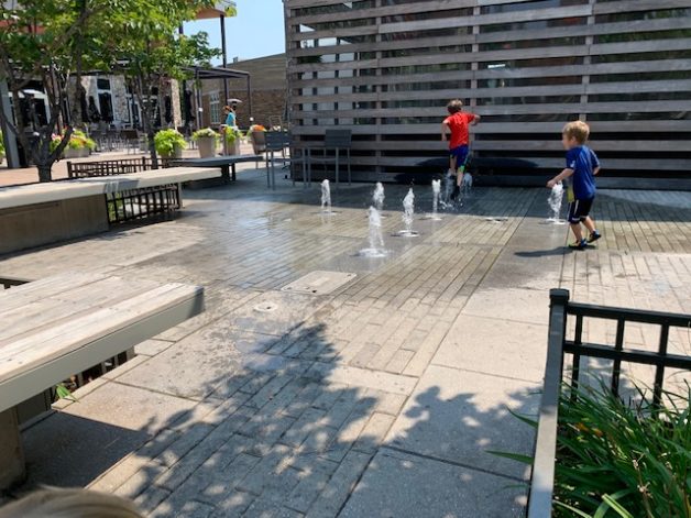 kids in a splash pad.