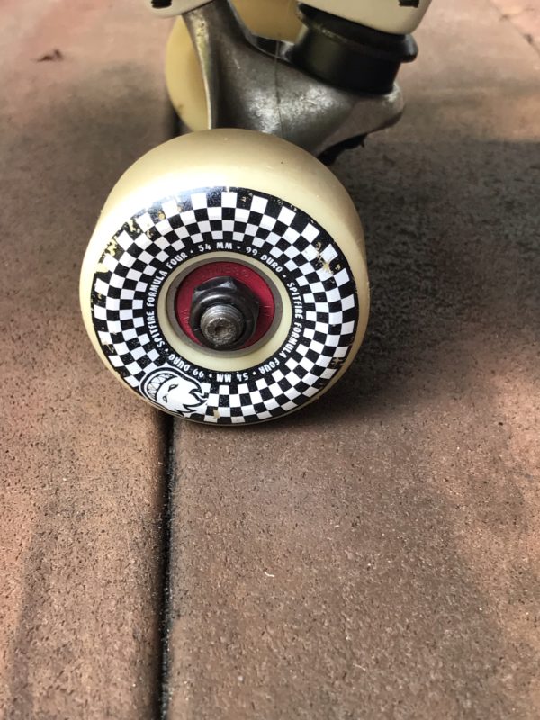 A checkered skateboard wheel.