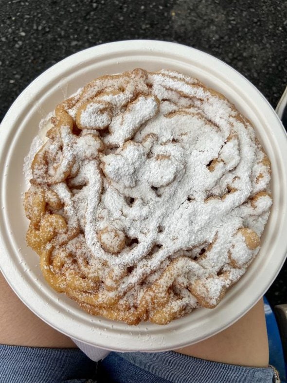 funnel cake on a plate.