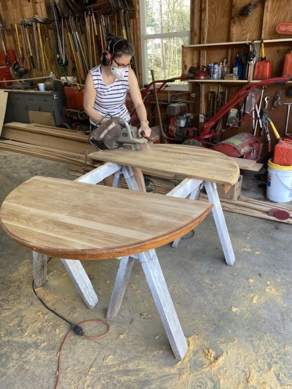 Kristen using a belt sander.