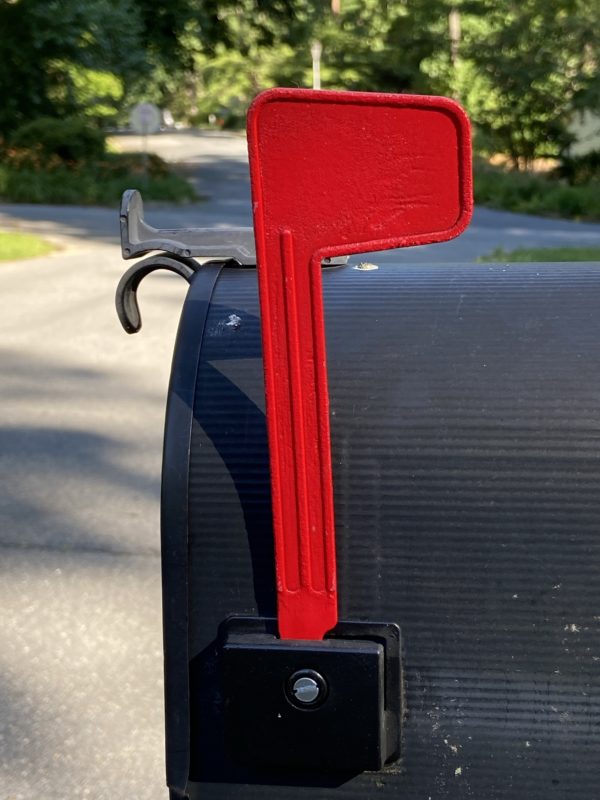 Bright red mailbox flag.