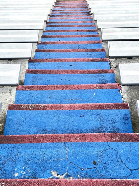 blue and red painted stairs.