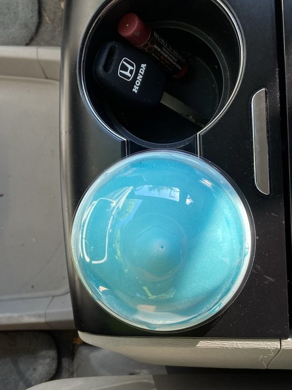 blue raspberry slurpee in cup holder.
