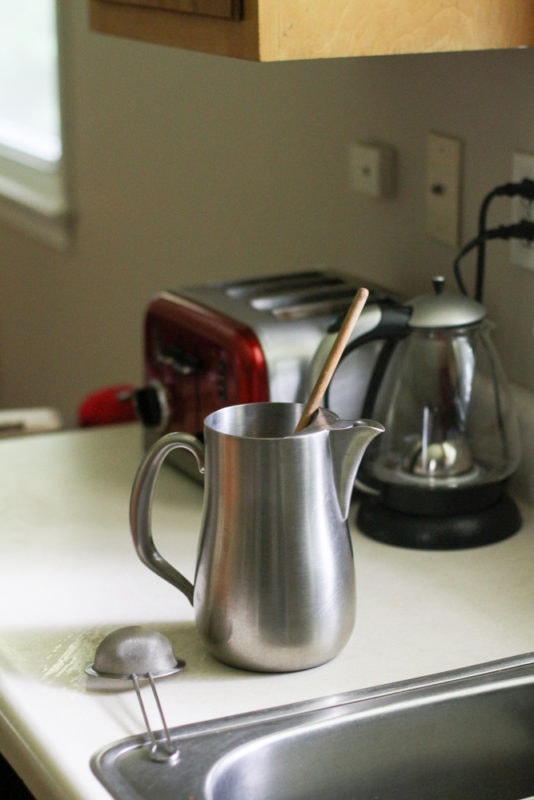 a stainless steel pitcher.