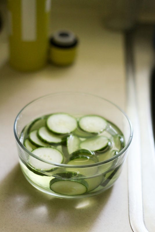 sliced cucumbers in water.