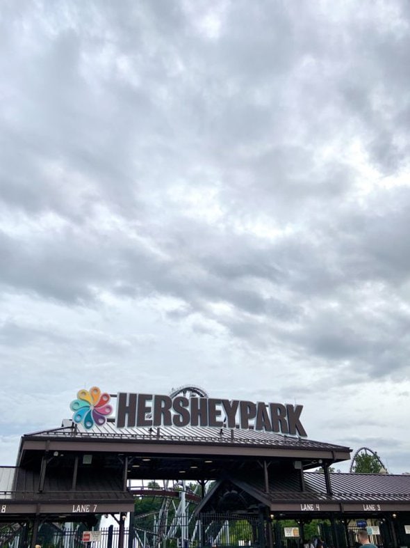 Hershey Park sign under cloudy skies.