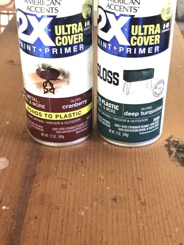 two cans of spray paint.