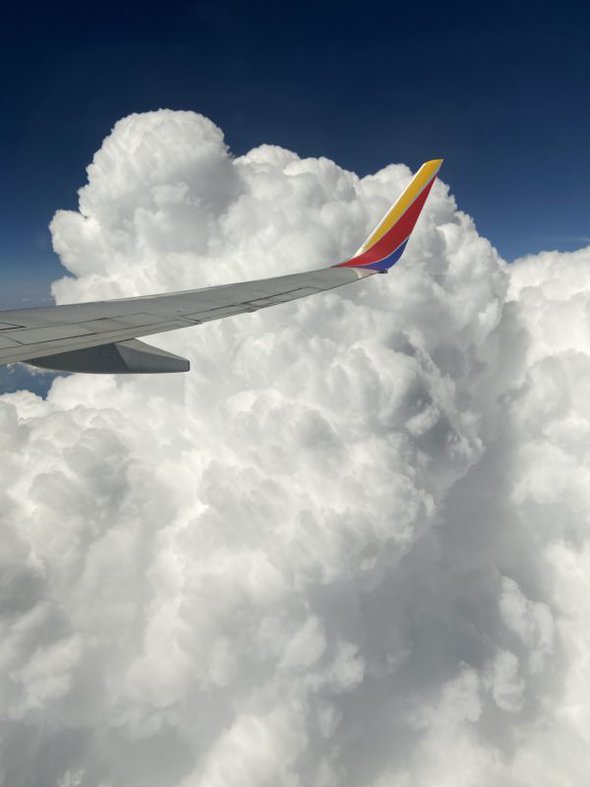 plane wing in a cloud.