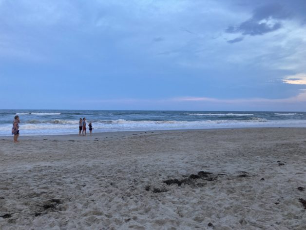 A beach at sunset.