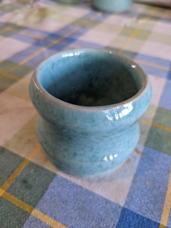 a blue handmade piece of pottery.
