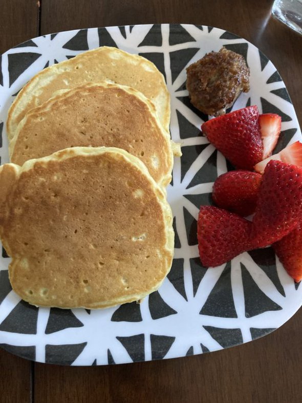 pancakes and fruit on a plate.