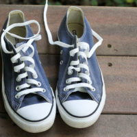 replacement laces in a pair of blue converse.