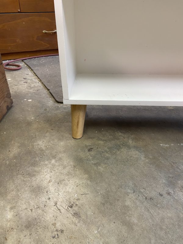 shelf legs on garage floor.