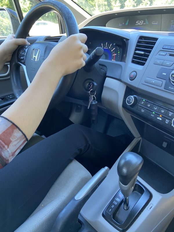 A teen driving a Civic.