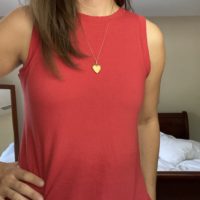 Kristen in a red sleeveless dress.