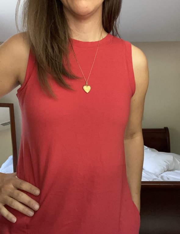 Kristen in a red sleeveless dress.