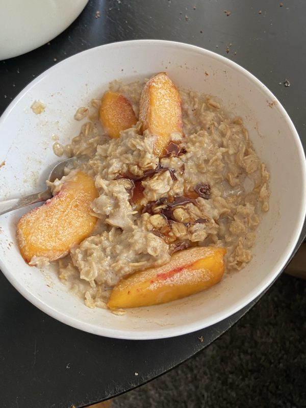 bowl of oatmeal with peaches.