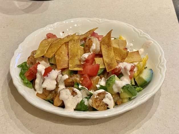 shrimp taco salad in white bowl.